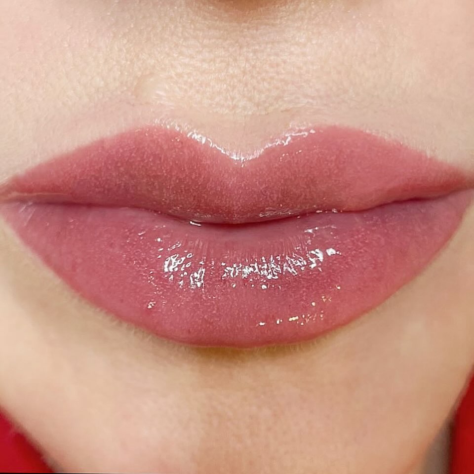 Healed result of lip tattoo with even, natural-looking blush tone and defined lip borders